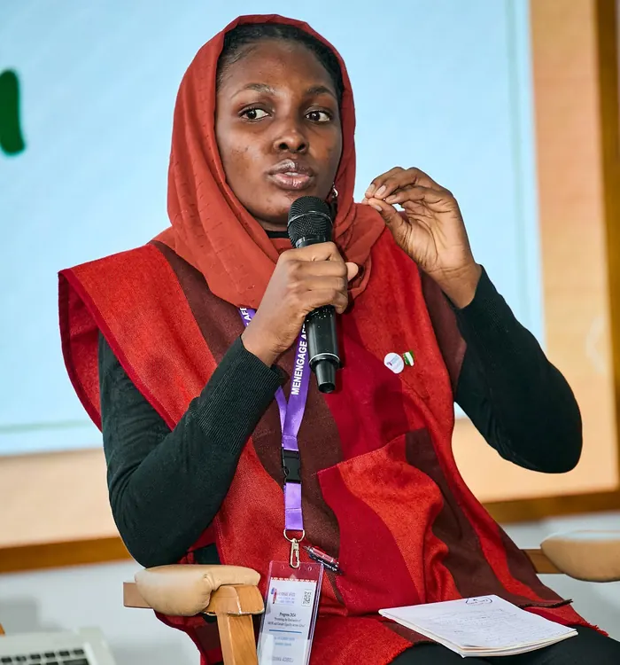 A young woman speaking at an advocacy event